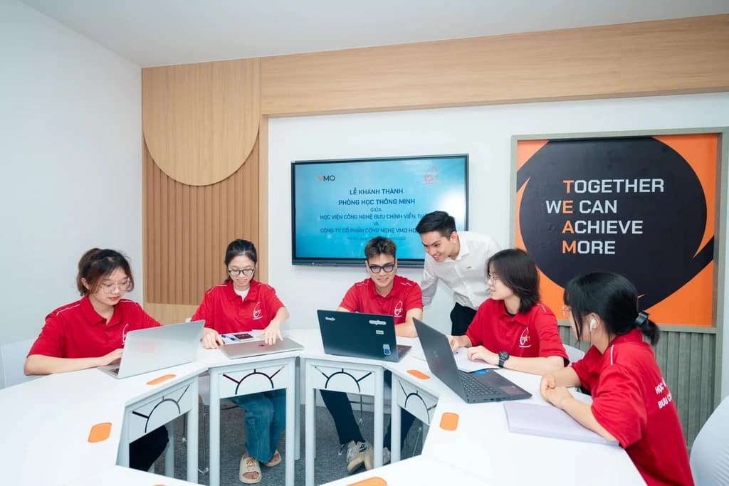 Institute students working at laptops in a smart classroom.